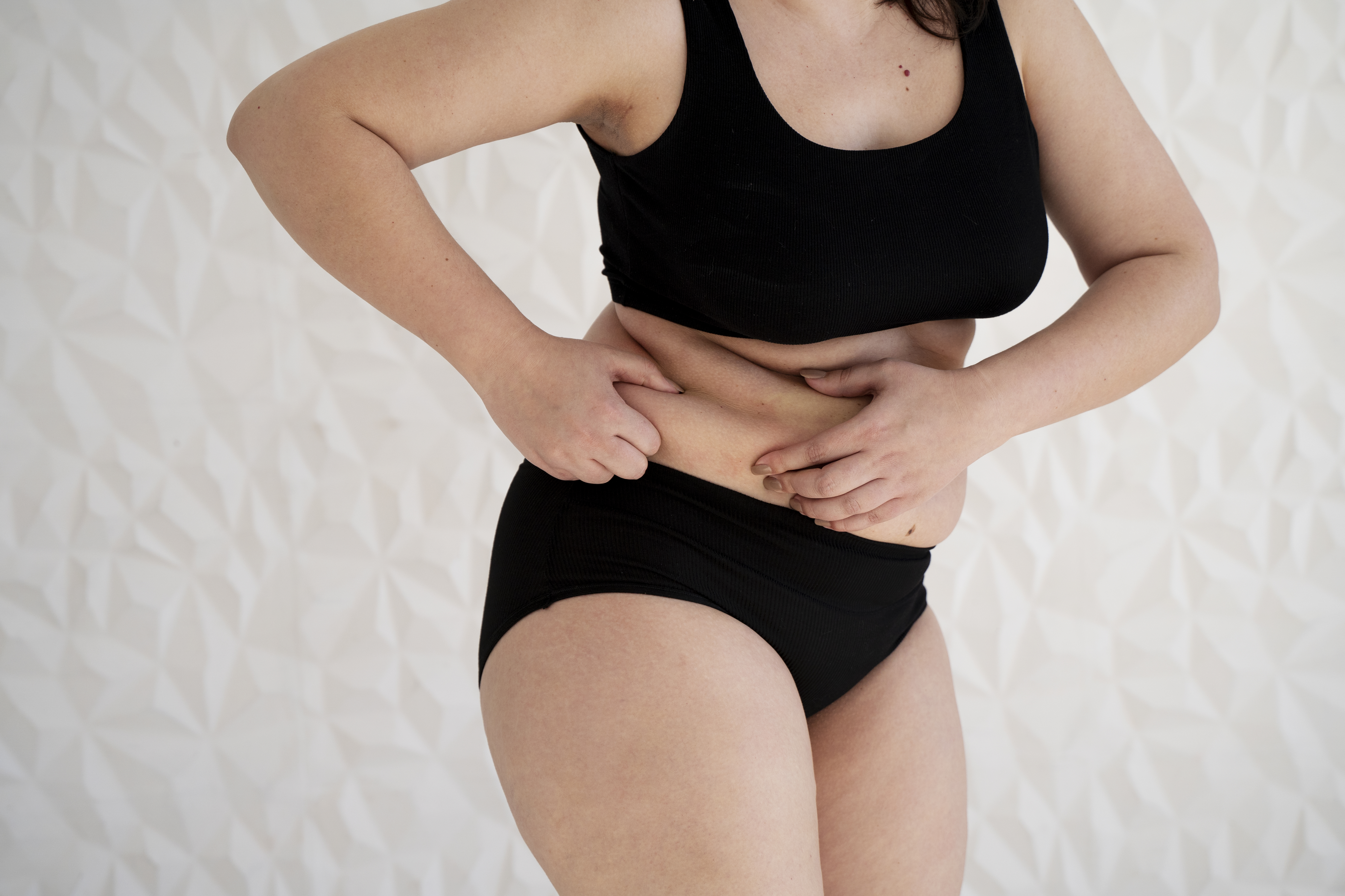side-view-woman-touching-her-skin.jpg